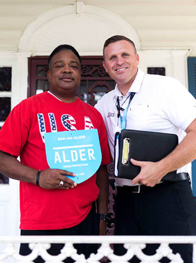 alder ceo standing next to customer